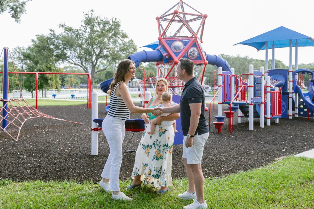 Melissa Rutland with a family at a St. Petersburg playground